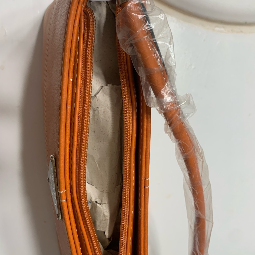Stylish clutch type bag with small strap
